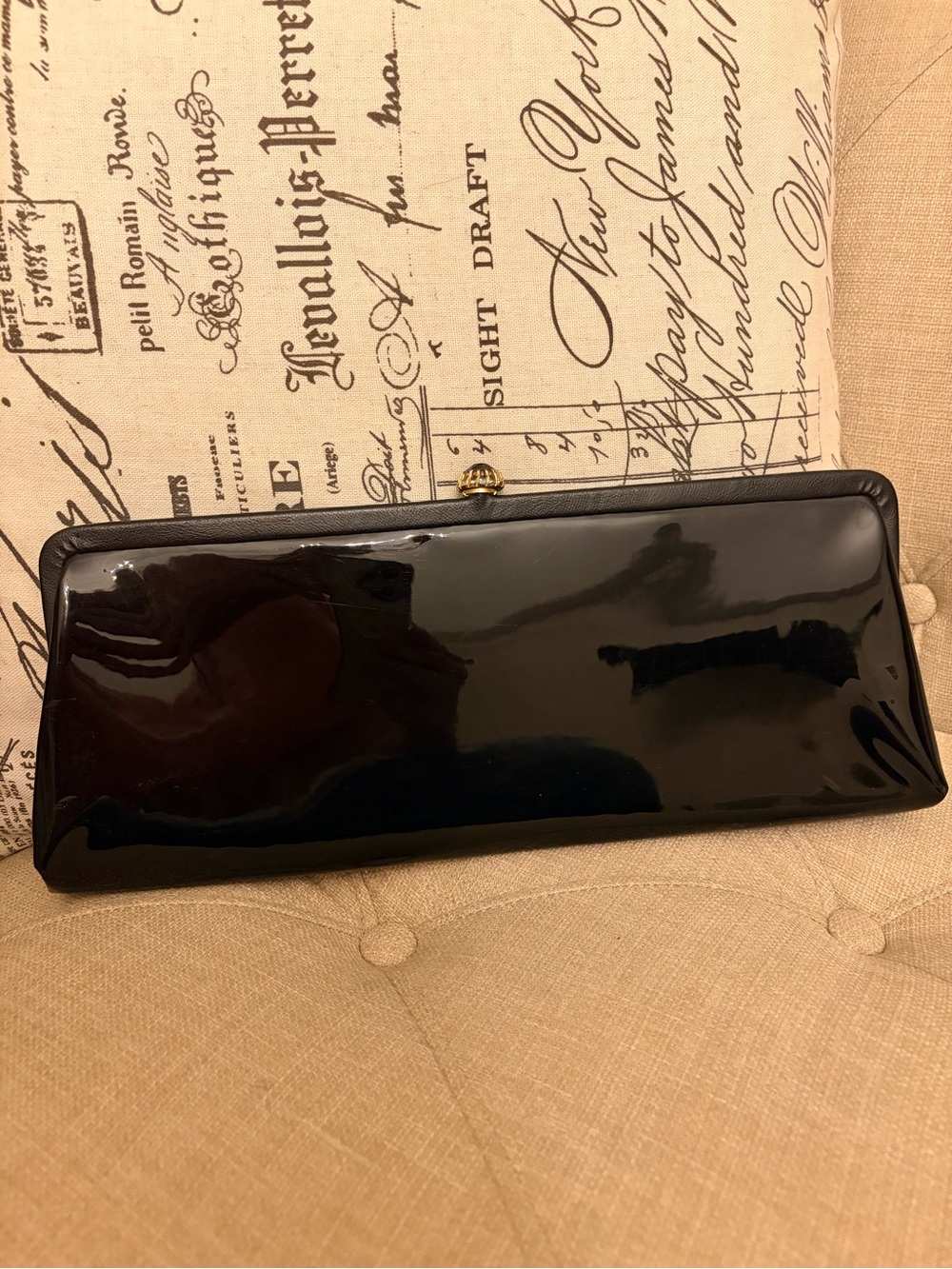 Vintage patent clutch with black and gold clasp